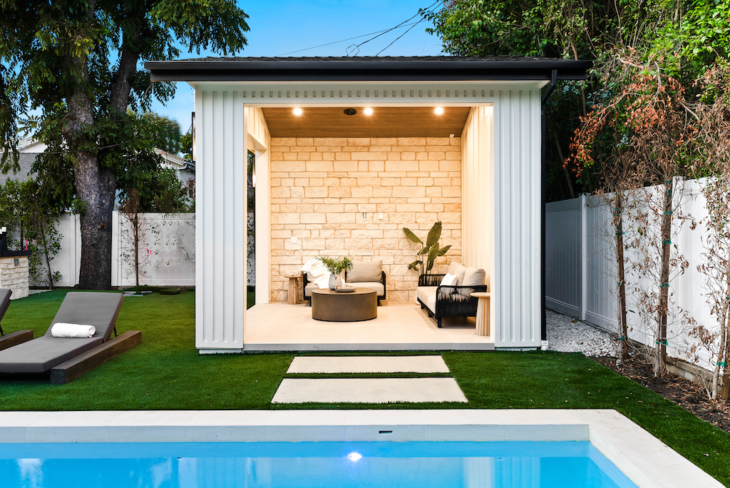 Modern poolside cabana with seating area