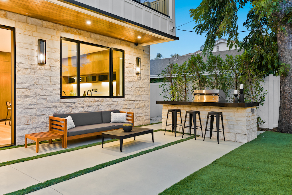 Modern backyard patio with outdoor kitchen