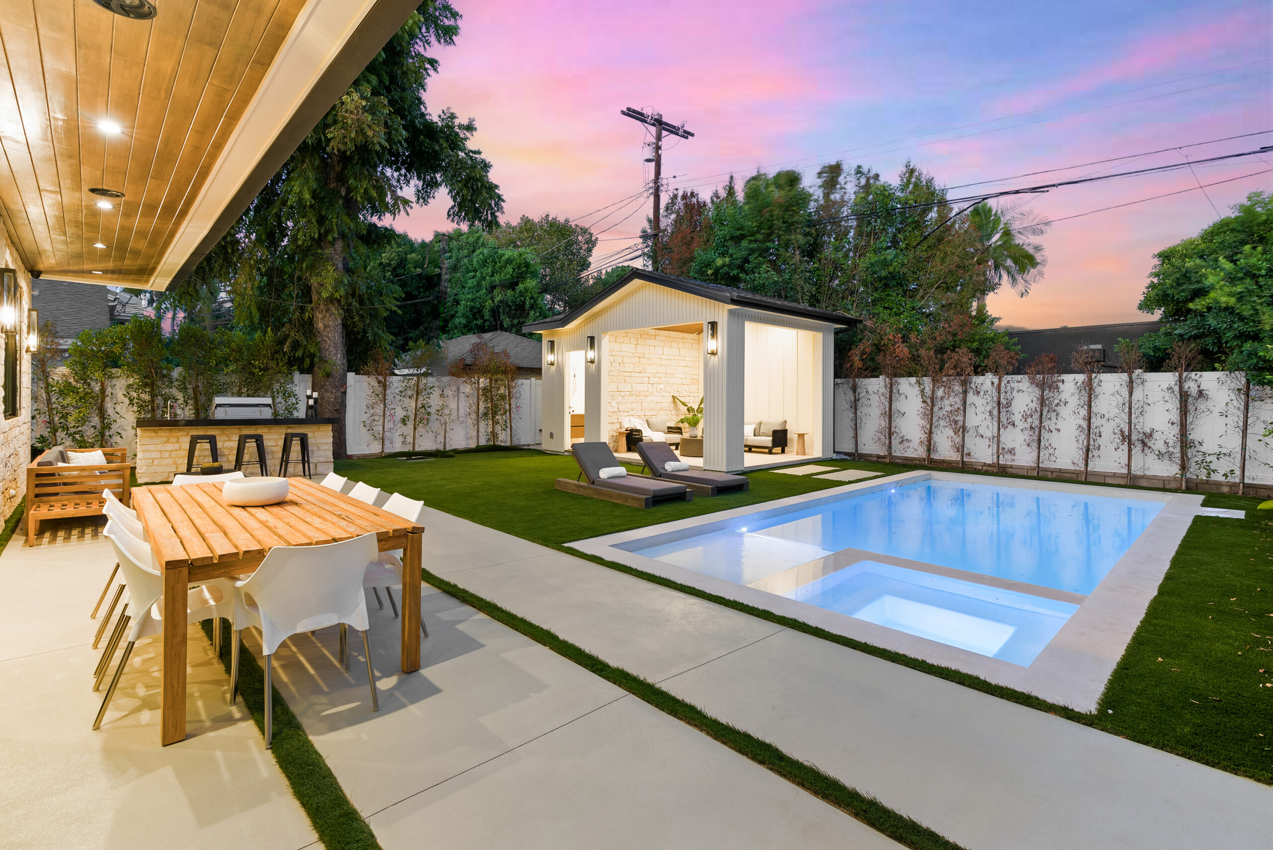 Modern backyard with pool and pool house