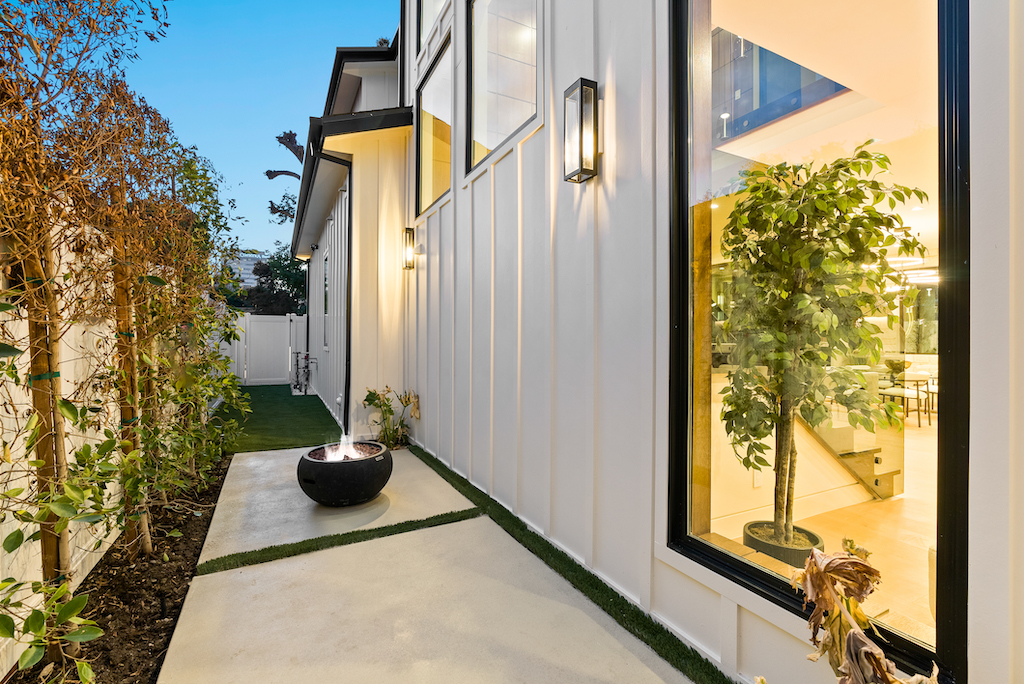Modern side walkway with fire bowl and window