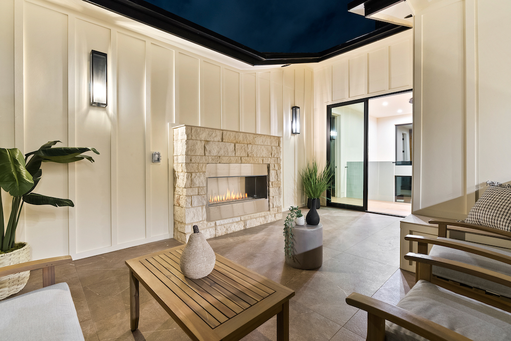 Modern outdoor patio with stone fireplace