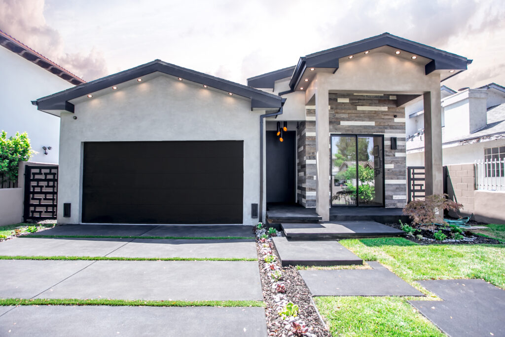 Modern house exterior with clean lines and minimalist landscaping.