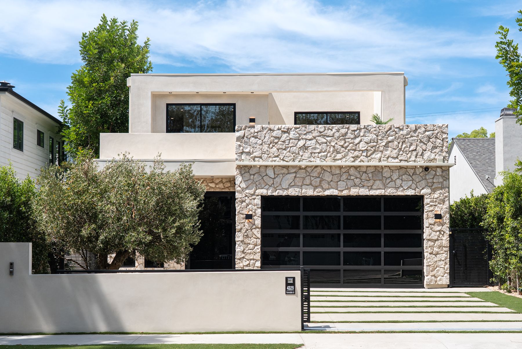 Luxury Home Builders custom home modern front facade and garage