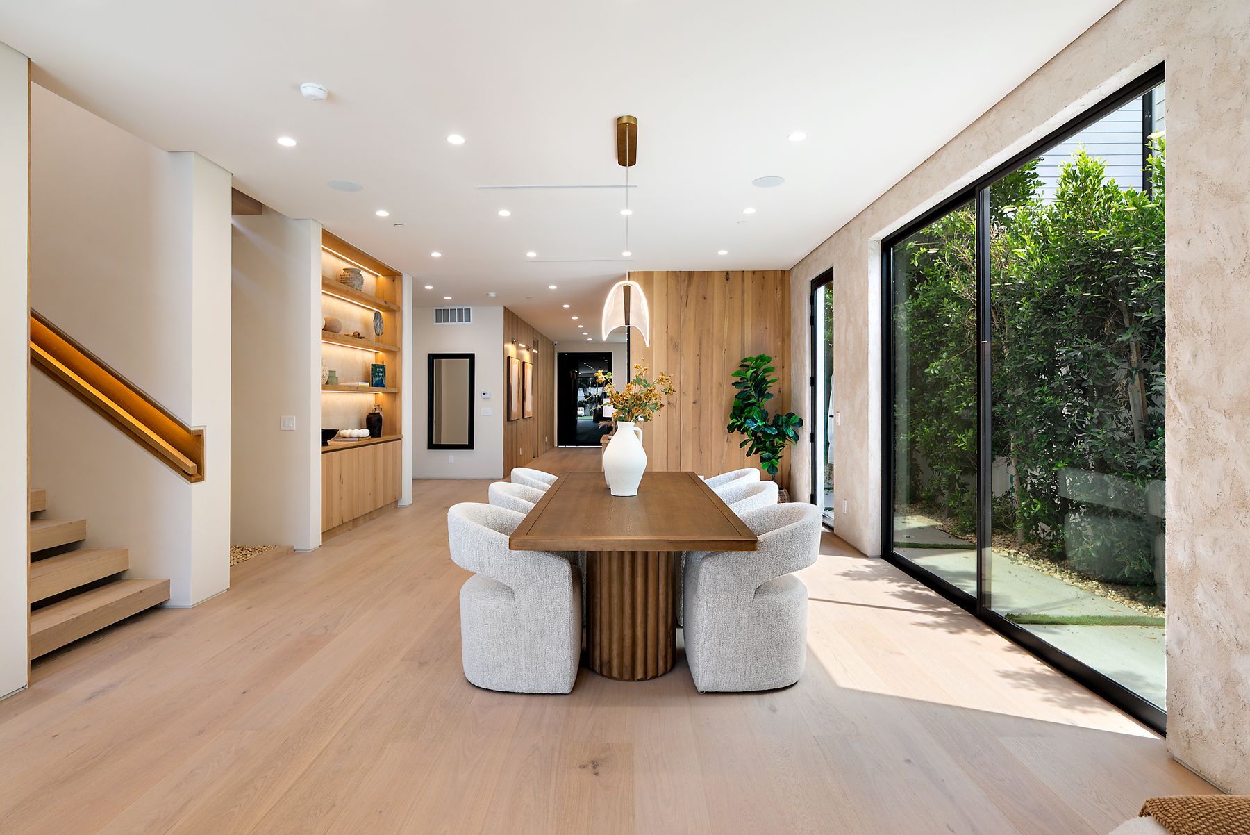 Luxury Home Builders custom home dining room beside the staircase