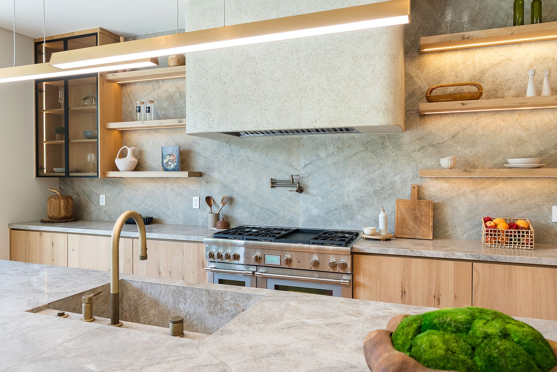 Luxury Home Builders custom home chef's kitchen with stone backsplash and range