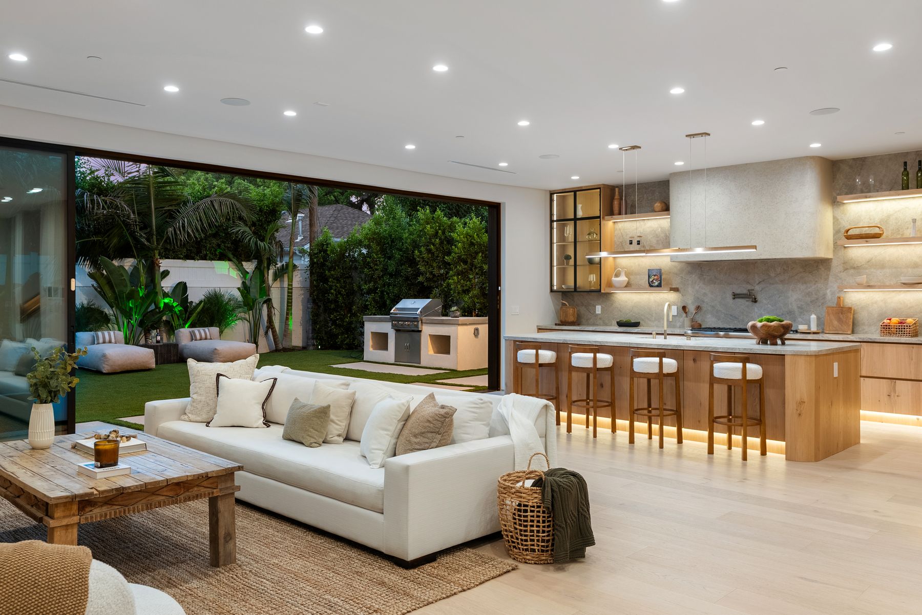 Luxury Home Builders custom home living room open to kitchen