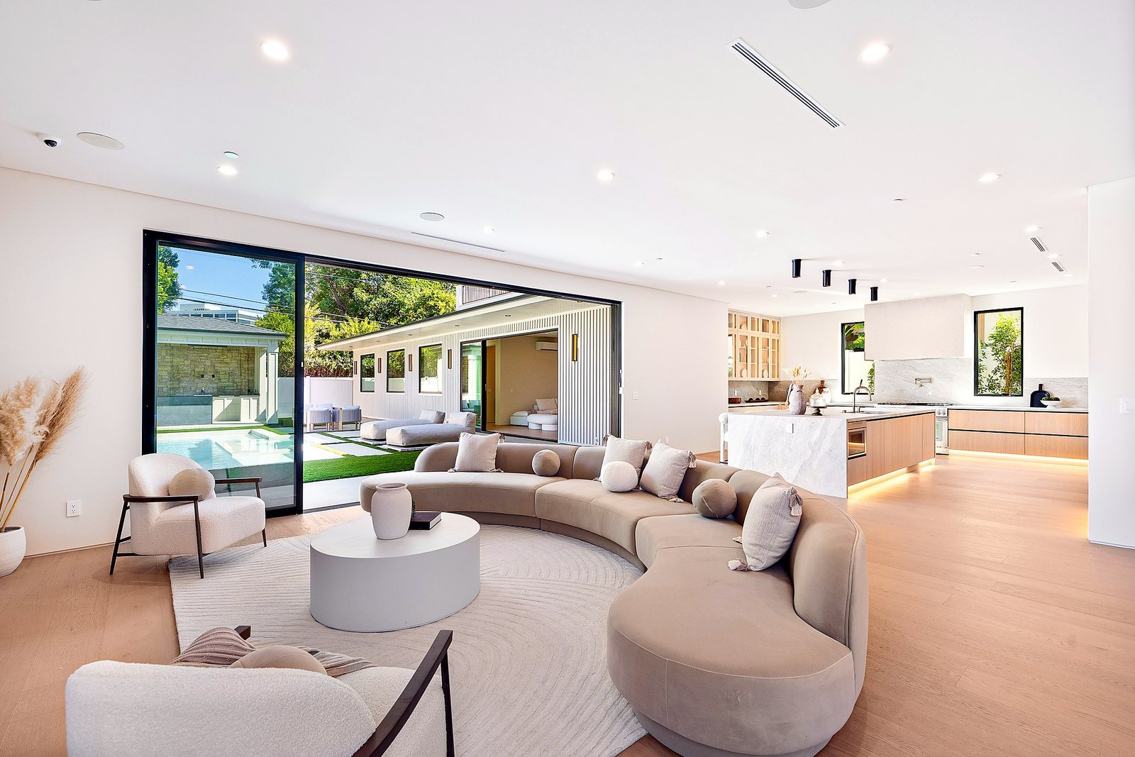 Great room with floor to ceiling glass in a Luxury Home Builders home